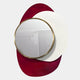 The Solistra Crimson I Layered Round Mirror 3D Wall Art by Giant Sculptures features a gold-framed mirror overlapping abstract white and red shapes, reflecting a white cabinet and decor against a light gray background.