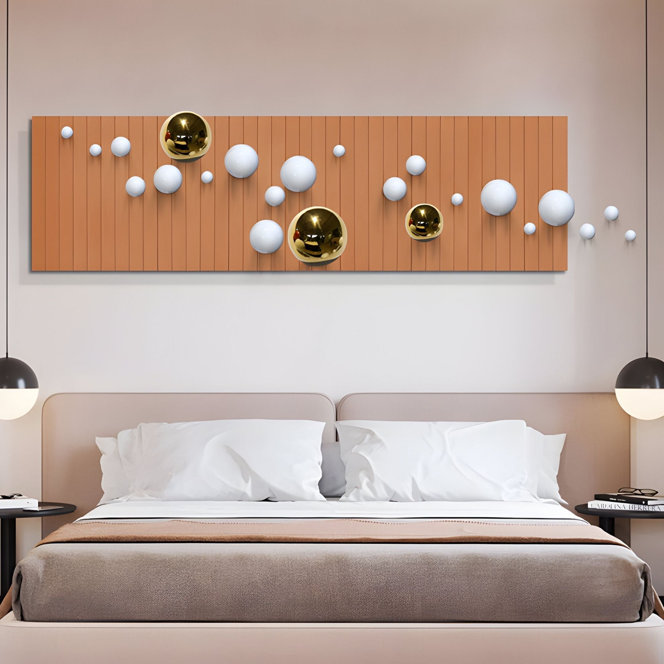 A modern bedroom features a double bed with white bedding, a tan headboard, and Giant Sculptures' Orbivance Amber, Gold & White Sphere Panel 3D Wall Art above the bed. Two pendant lamps hang on either side.