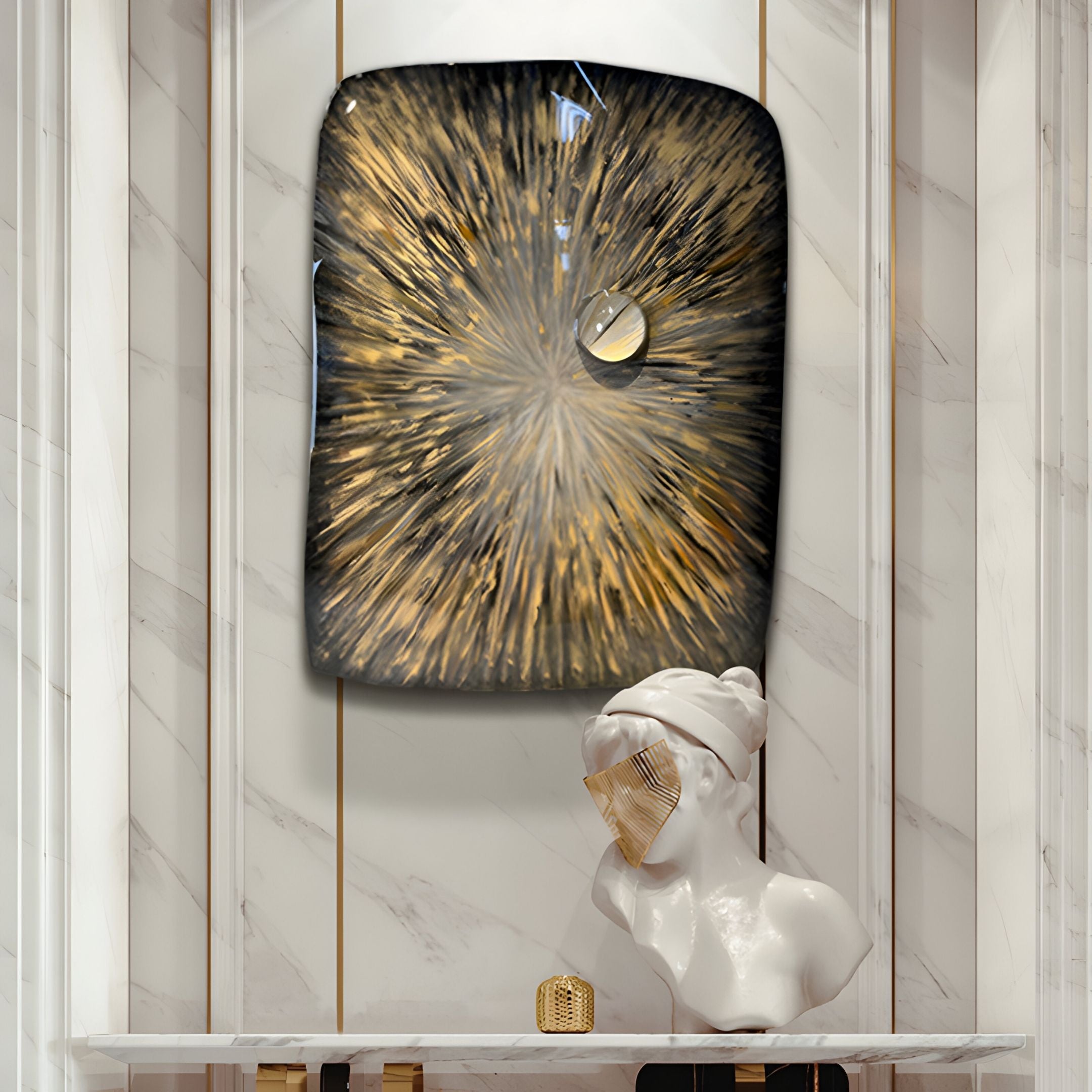 A marble bust with a gold face mask sits on a shelf below the Solarien Aureate Burst Sculptural 3D Wall Art by Giant Sculptures, which features gold and black rays radiating from a circular metallic accent against white marble.