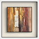 The Terralume Amber Rust Abstract Textured Framed Wall Art by Giant Sculptures features vertical brushstrokes in warm brown, gold, orange, and red tones with a central light beige stripe and a richly textured surface.