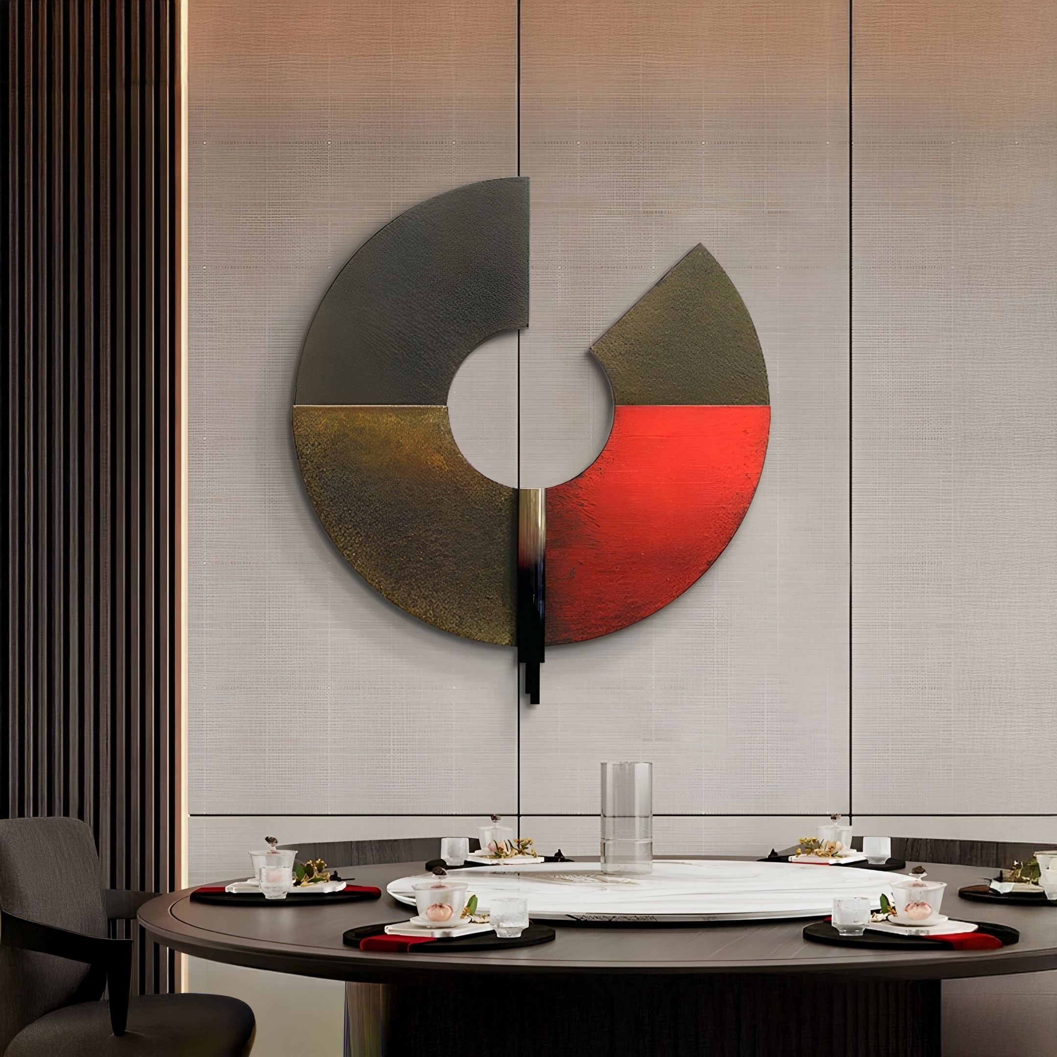 A modern dining room features a round table for four and the Vortaryn Ember & Rust Circle Sculptural 3D Wall Art by Giant Sculptures—a striking circular piece with black, bronze, and red segments—on a neutral wall.