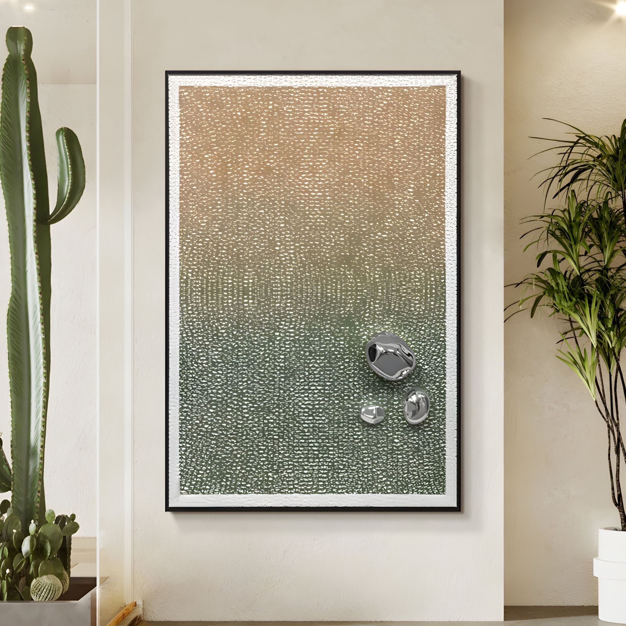 The Lumevara Sandstone Gradient & Chrome Droplet 3D Wall Art by Giant Sculptures features a beige-to-green gradient and metallic shapes in the corner, displayed on a light wall near plants.
