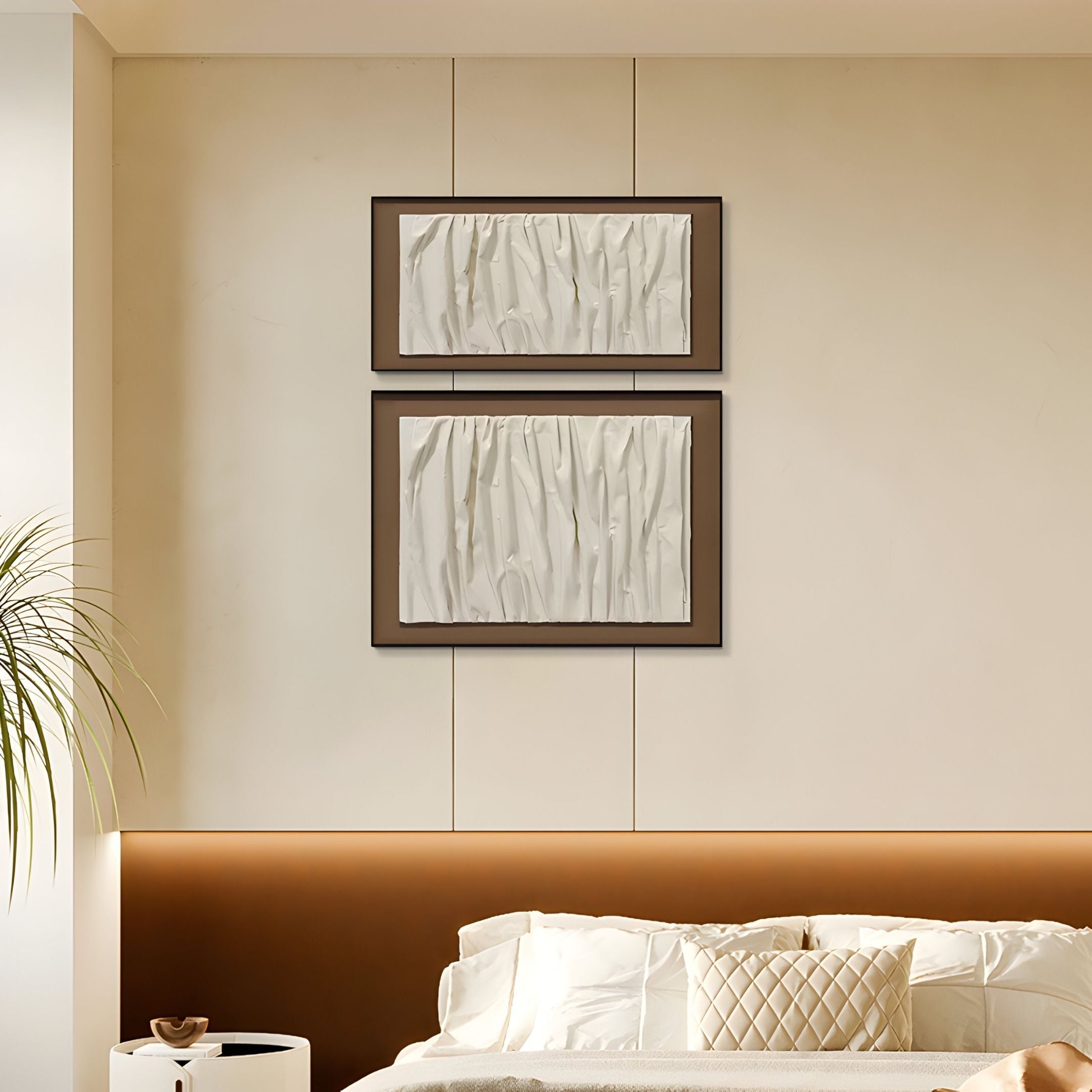 A modern bedroom features beige walls, a white and tan bed, and the Foldara Cream & Mocha Draped Paper Dual-Panel 3D Wall Art by Giant Sculptures above the headboard. A potted plant on the left adds a serene wabi-sabi decor touch.
