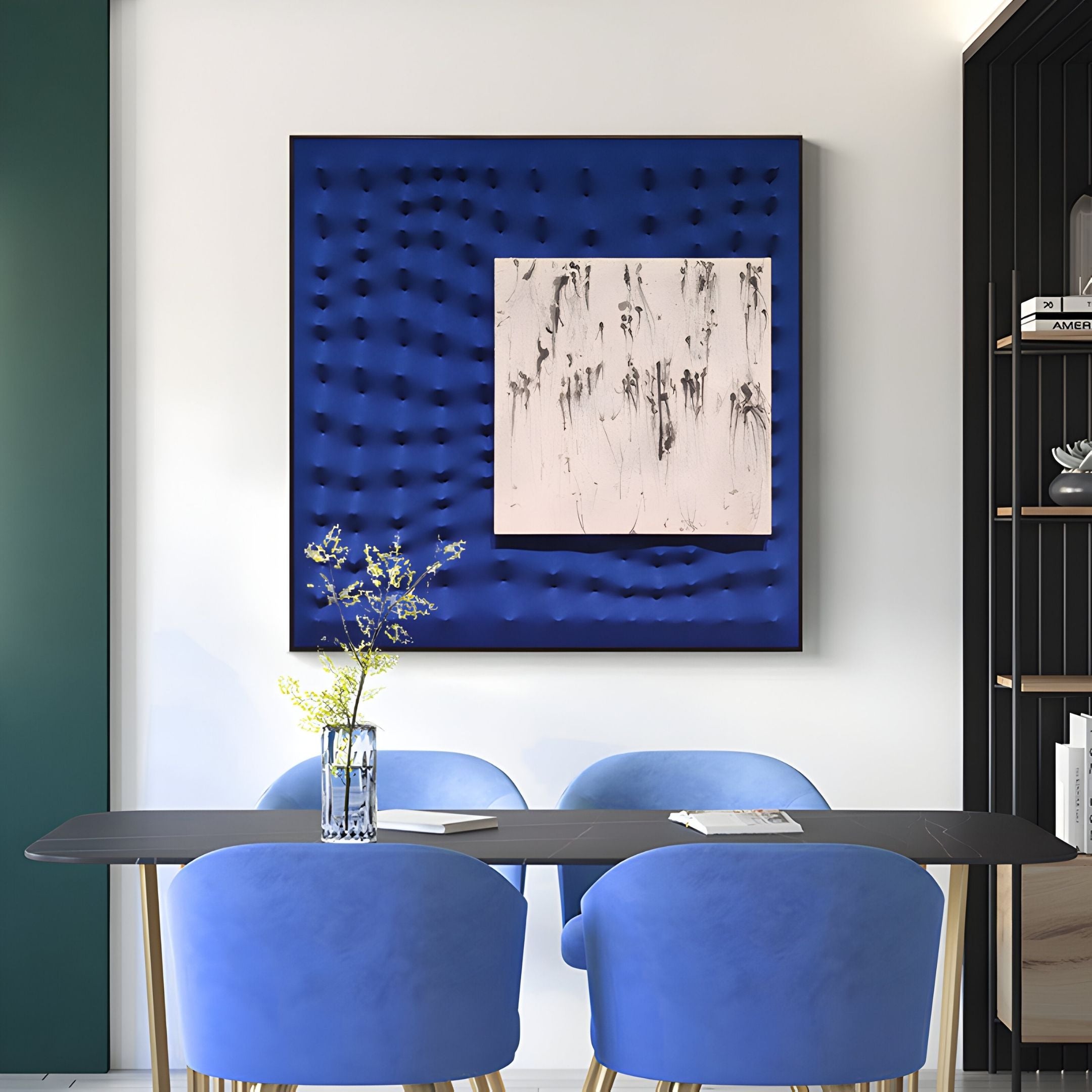 A modern dining area features four blue velvet chairs, a black rectangular table, and flowers. On the wall is the Loftera Blue Sculpted Fabric & Abstract Canvas 3D Wall Art by Giant Sculptures—a striking textured centerpiece. Shelves sit to the right.