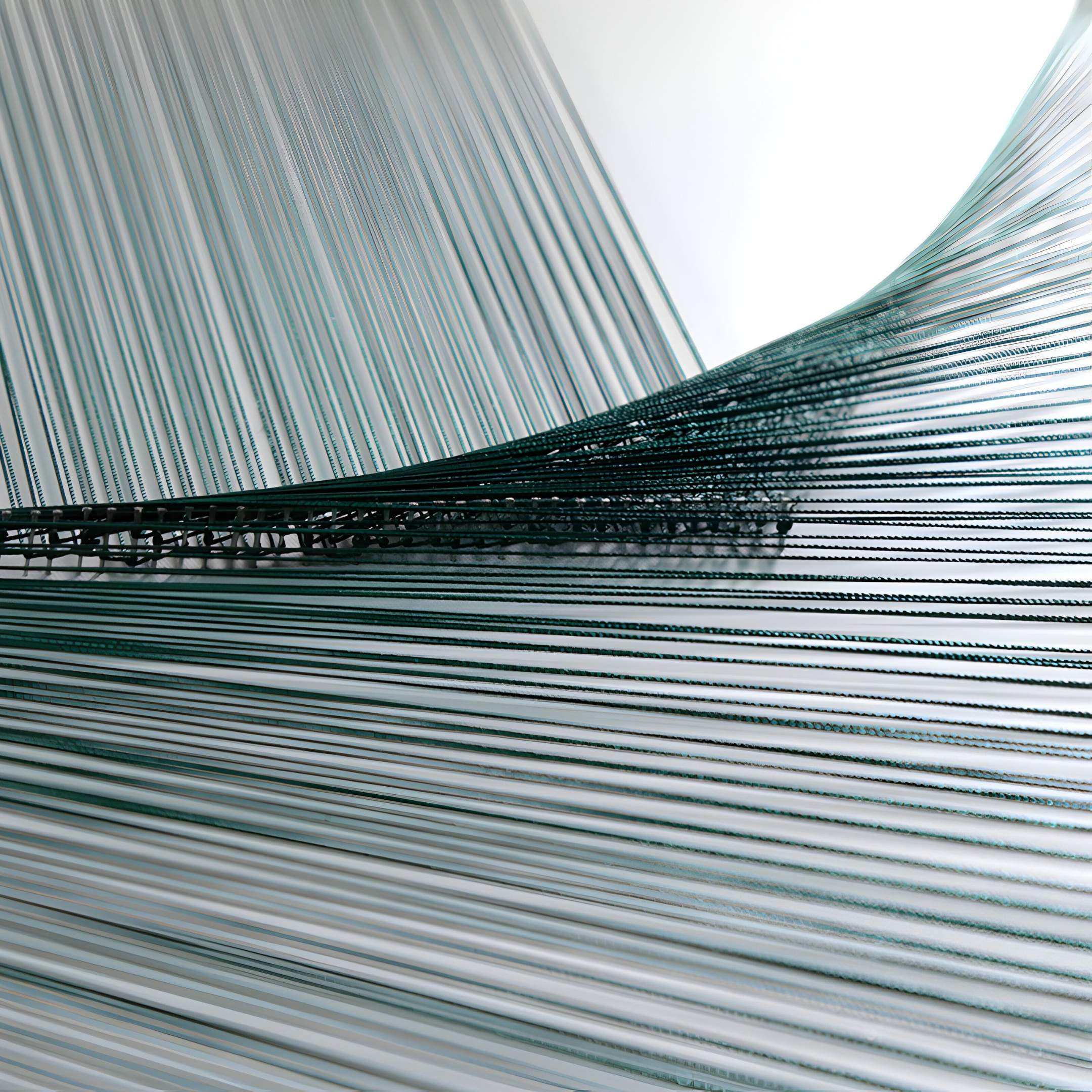 The LineaFlux Deep Teal Thread Warp Geometric 3D Wall Art by Giant Sculptures features an intricate close-up of parallel threads, some curving and others taut, creating striking geometric patterns reminiscent of textile weaving.