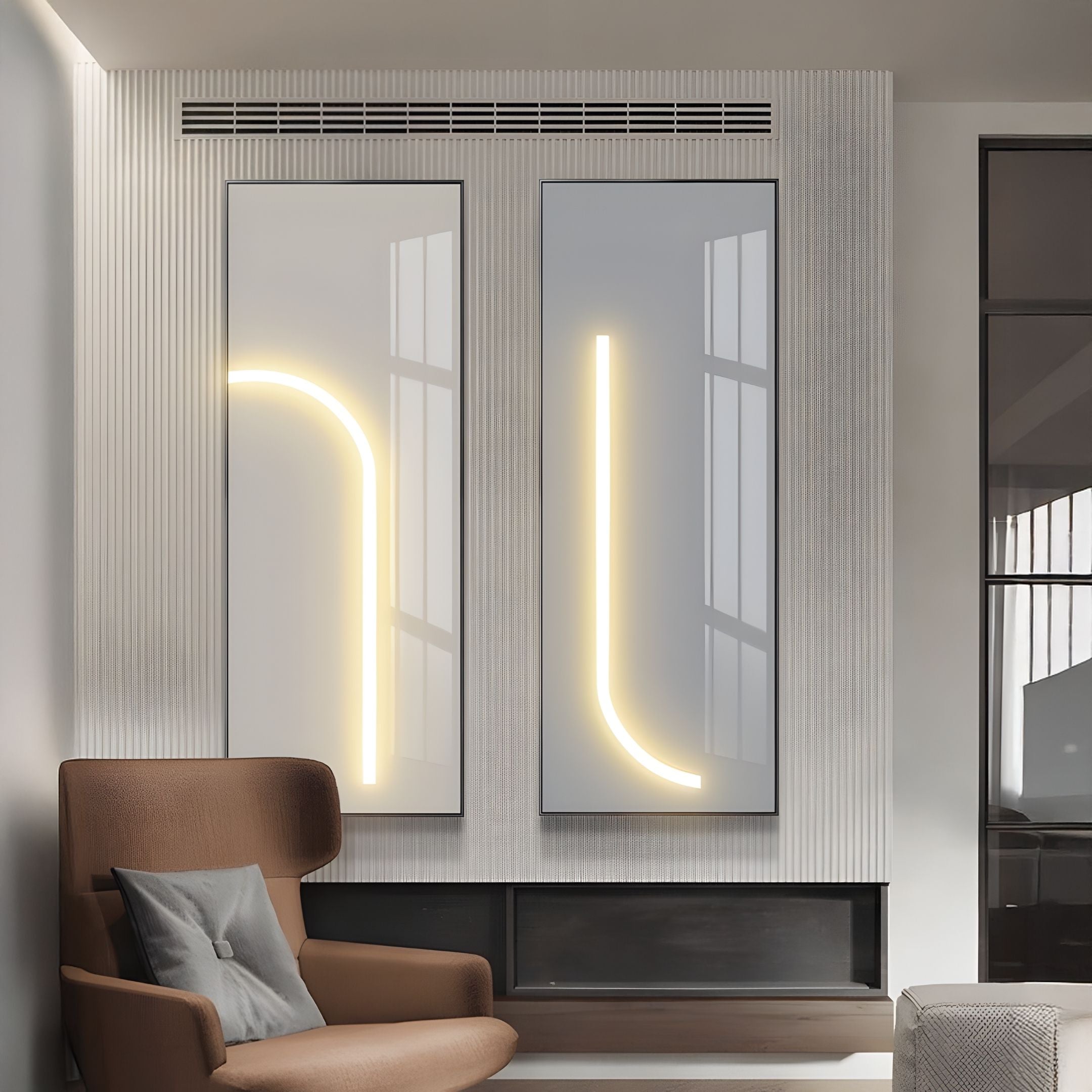 A modern living room features a brown armchair with a cushion and two Giant Sculptures Luminarch 2-Set Taupe & Grey LED Minimalist Wall Art panels—one with a neon curve, the other L-shaped—enhancing the contemporary style.