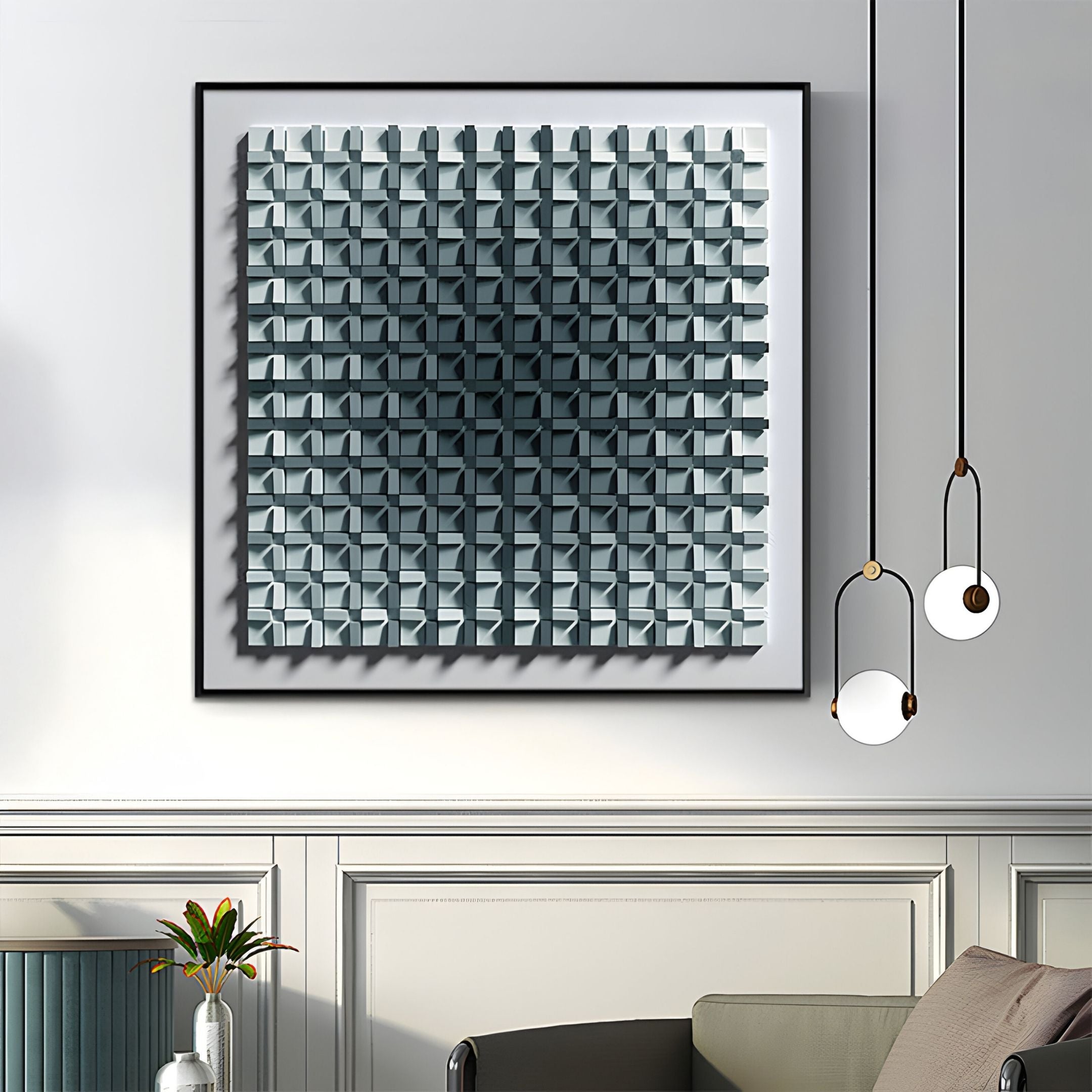 A modern living room showcases the Gradisect Slate Teal Fade Geometric 3D Wooden Wall Art by Giant Sculptures—a grid of blue and gray cubes above white-paneled wainscot. Three pendant lights and a plant complete the stylish geometric decor.