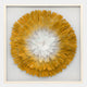 The Plumesse Golden Bloom Layered Feather 3D Wall Art by Giant Sculptures showcases a large circular flower with yellow and white gradient feathers, creating striking contemporary décor against a light background.