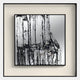 The Stratonis Monochrome Abstract Textured Framed Wall Art by Giant Sculptures features black vertical dripping lines on a white and gray background, evoking an industrial cityscape—perfect for modern minimalist decor.