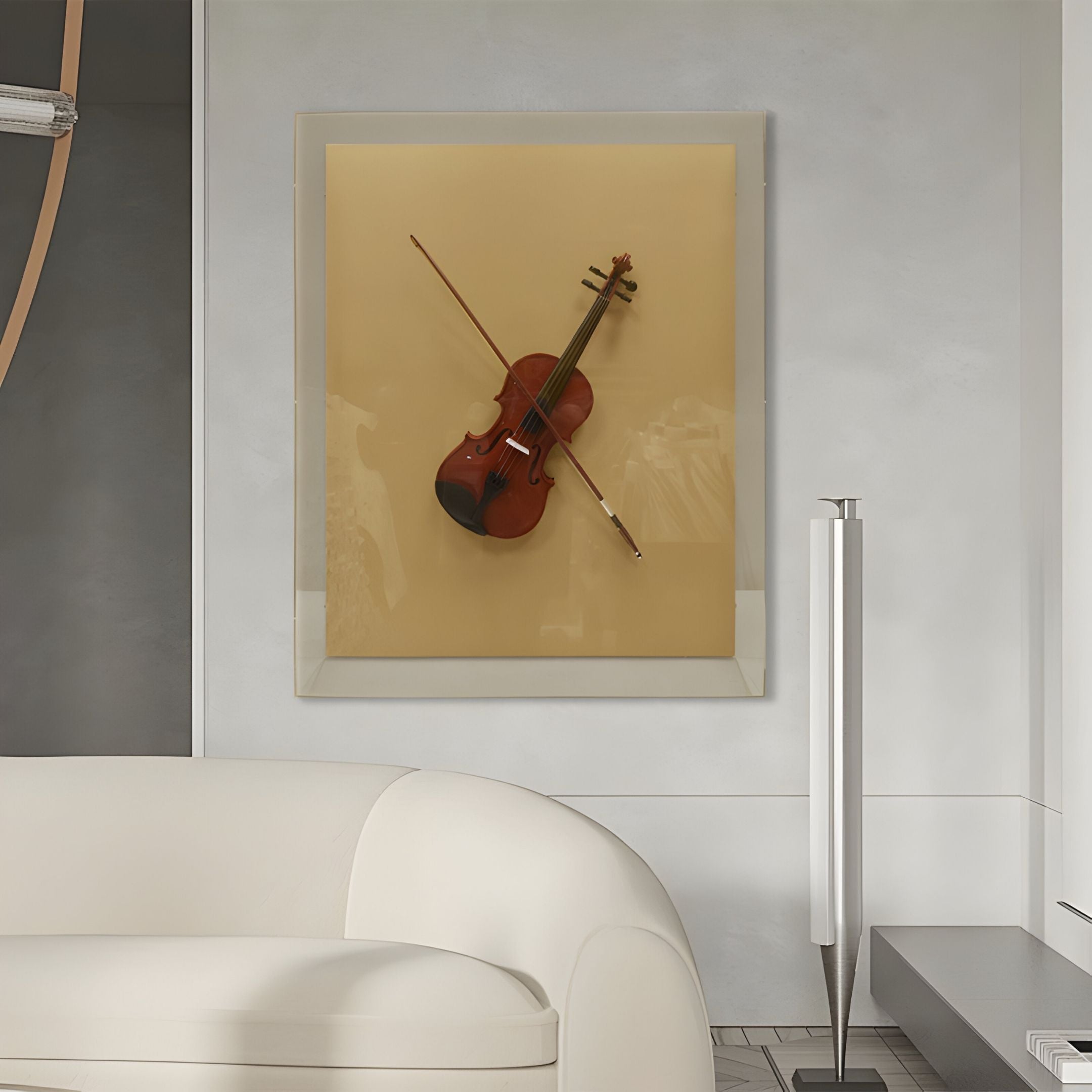 A modern living room featuring the Giant Sculptures Archetto Beige Violin Acrylic Framed 3D Wall Art above a white curved sofa, showcasing a violin and bow on a beige background inside an elegant glass frame.