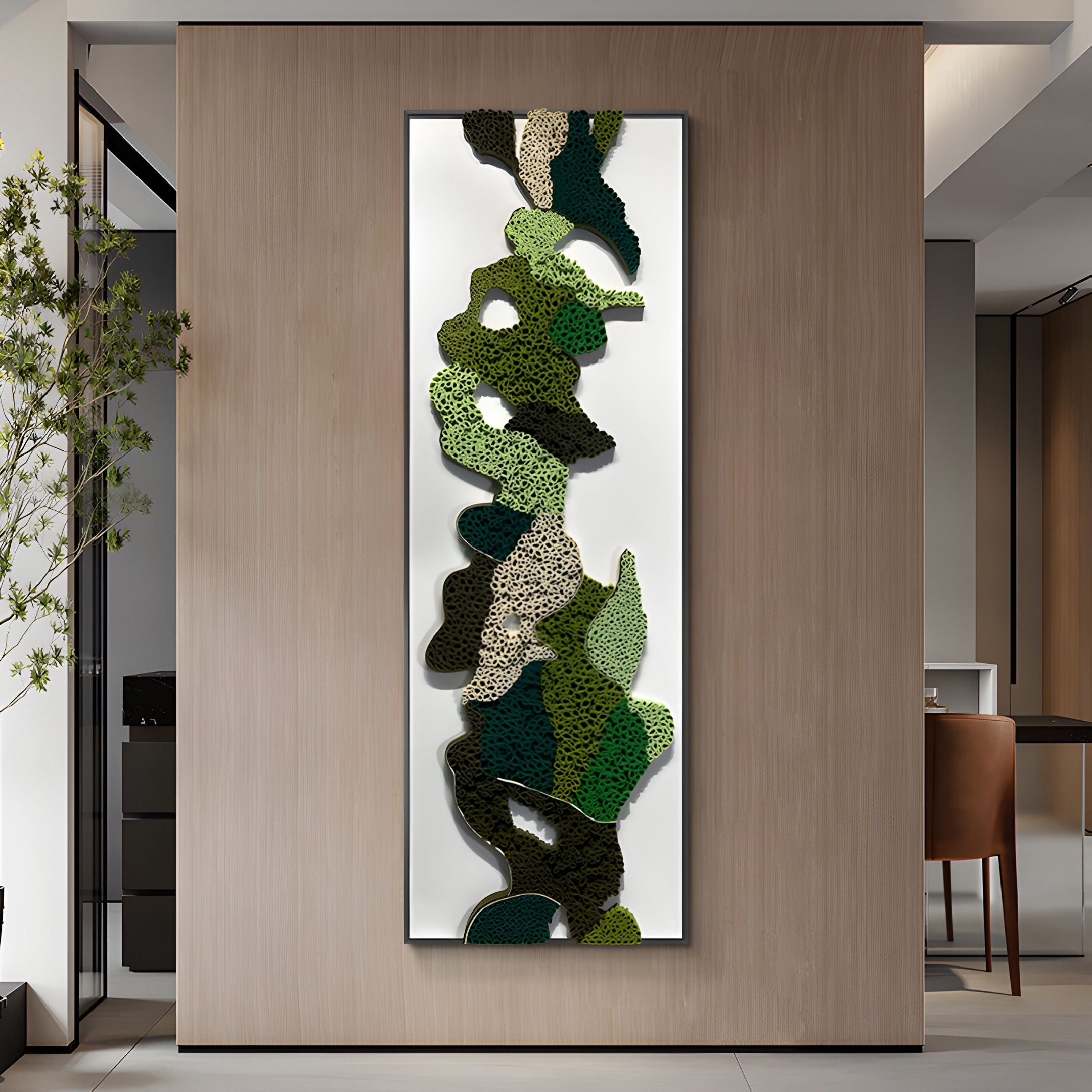 The Verdurelle Green Layered Flow Felt 3D Wall Art by Giant Sculptures, featuring abstract green, black, and beige sponge-like textures, hangs on a light wood-paneled wall in this modern minimalist room.
