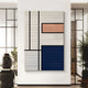 The Gridoria Peach & Navy Linear Block Woven Wall Art by Giant Sculptures features black lines dividing textured white, peach, and blue rectangles—ideal for modern decor in rooms with glass panels and potted plants.
