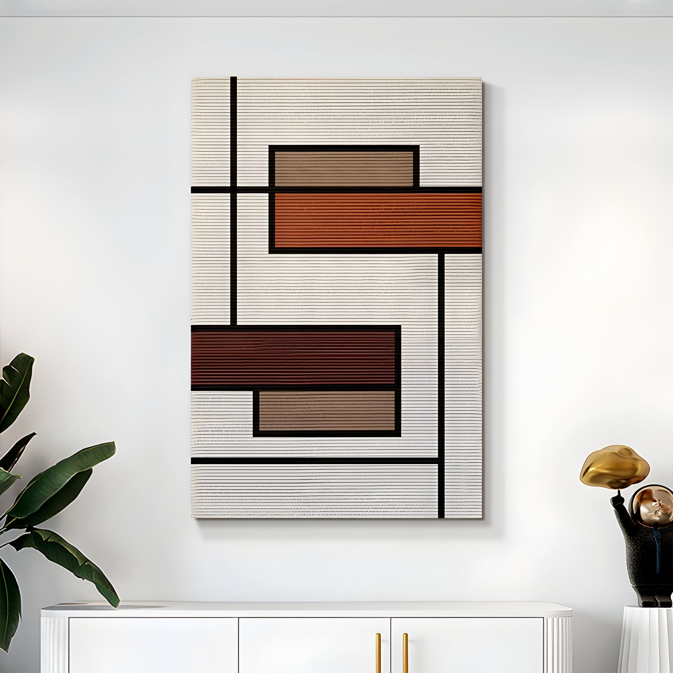 The Gridoria Rust & Taupe Linear Block Woven Wall Art by Giant Sculptures features black lines and rectangles in rust, orange, and beige shades—perfect for modern minimalist decor above a white cabinet with a plant and gold accent.