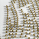 The Auravolta I Pearl Beads Swirl Pattern 3D Wall Art by Giant Sculptures features rows of shiny golden spheres in a grid on a white surface, each casting soft shadows for striking, abstract wall decor.