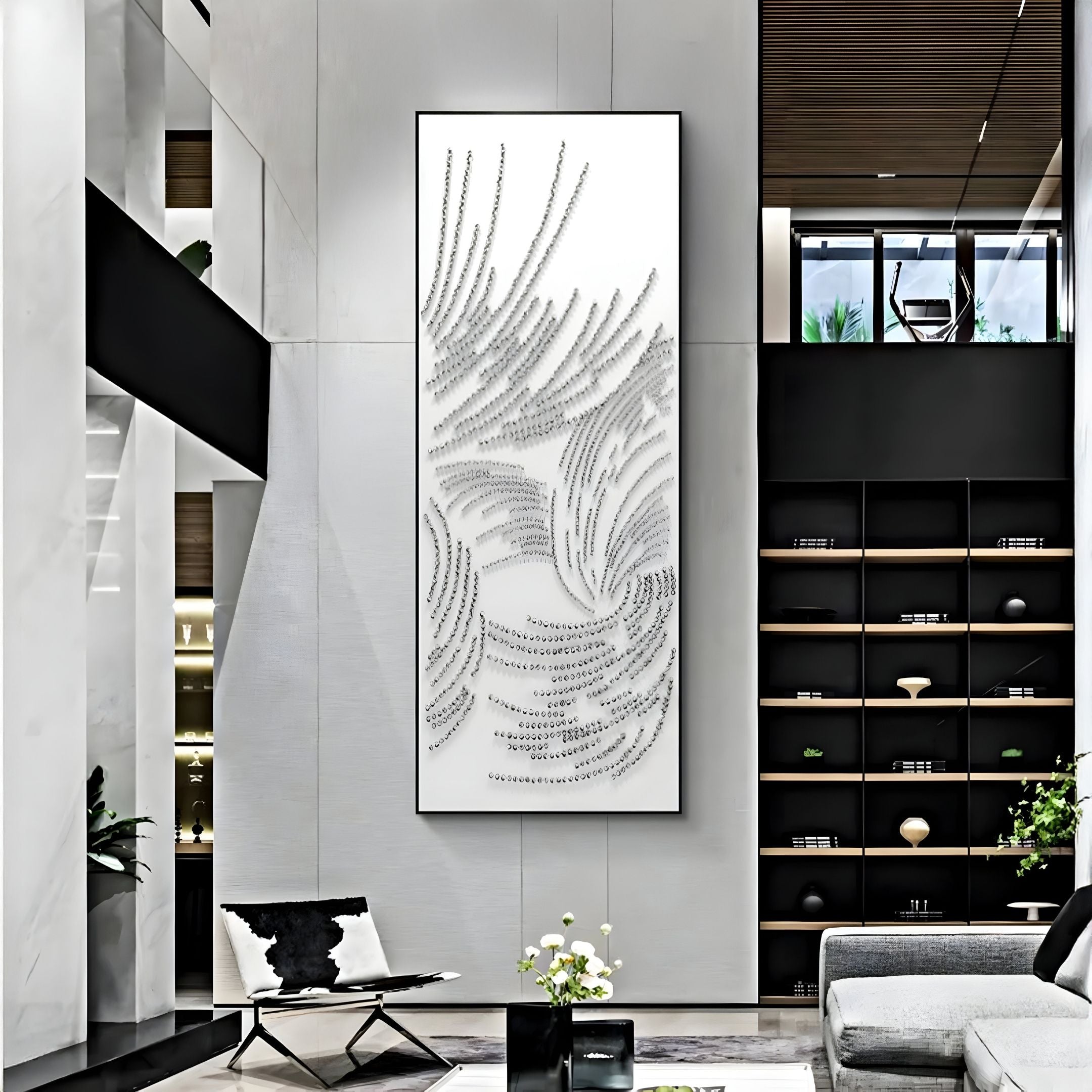 A modern living room with tall white walls, black shelves, a gray sofa, and a chair with a black-and-white pillow showcases the Auravolta II Pearl Beads Swirl Pattern 3D Wall Art by Giant Sculptures.