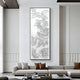 A modern living room featuring the Auravolta V Pearl Beads Swirl Pattern 3D Wall Art by Giant Sculptures on tall white minimalist paneled walls, plus a light gray sectional sofa with brown and beige pillows and low tables.