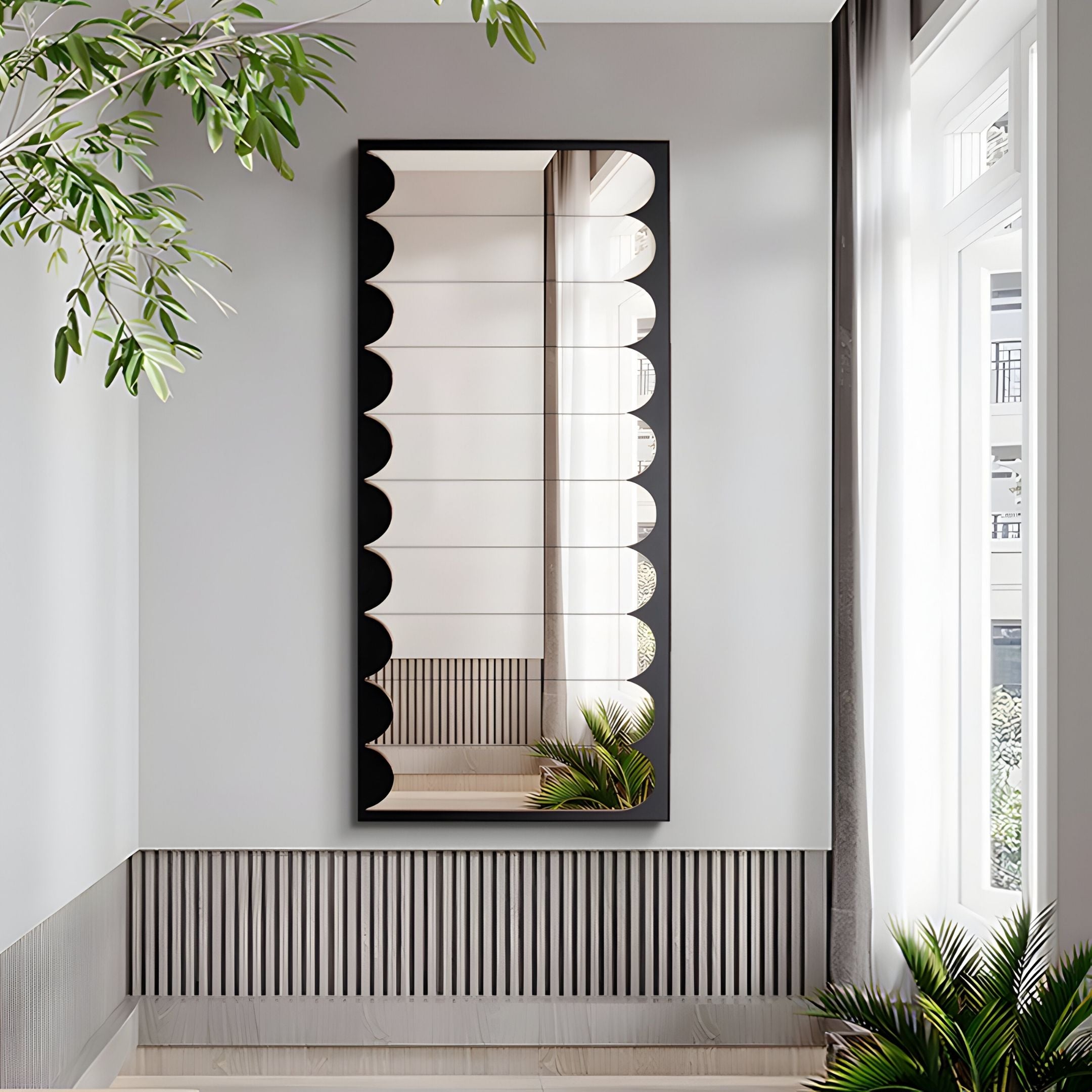 A modern hallway features the Lumiscale Black & White Modular Glass Wall Mirror by Giant Sculptures, with a decorative scalloped edge. Gray walls, striped paneling, and natural light enhance the contemporary decor with stylish touches.