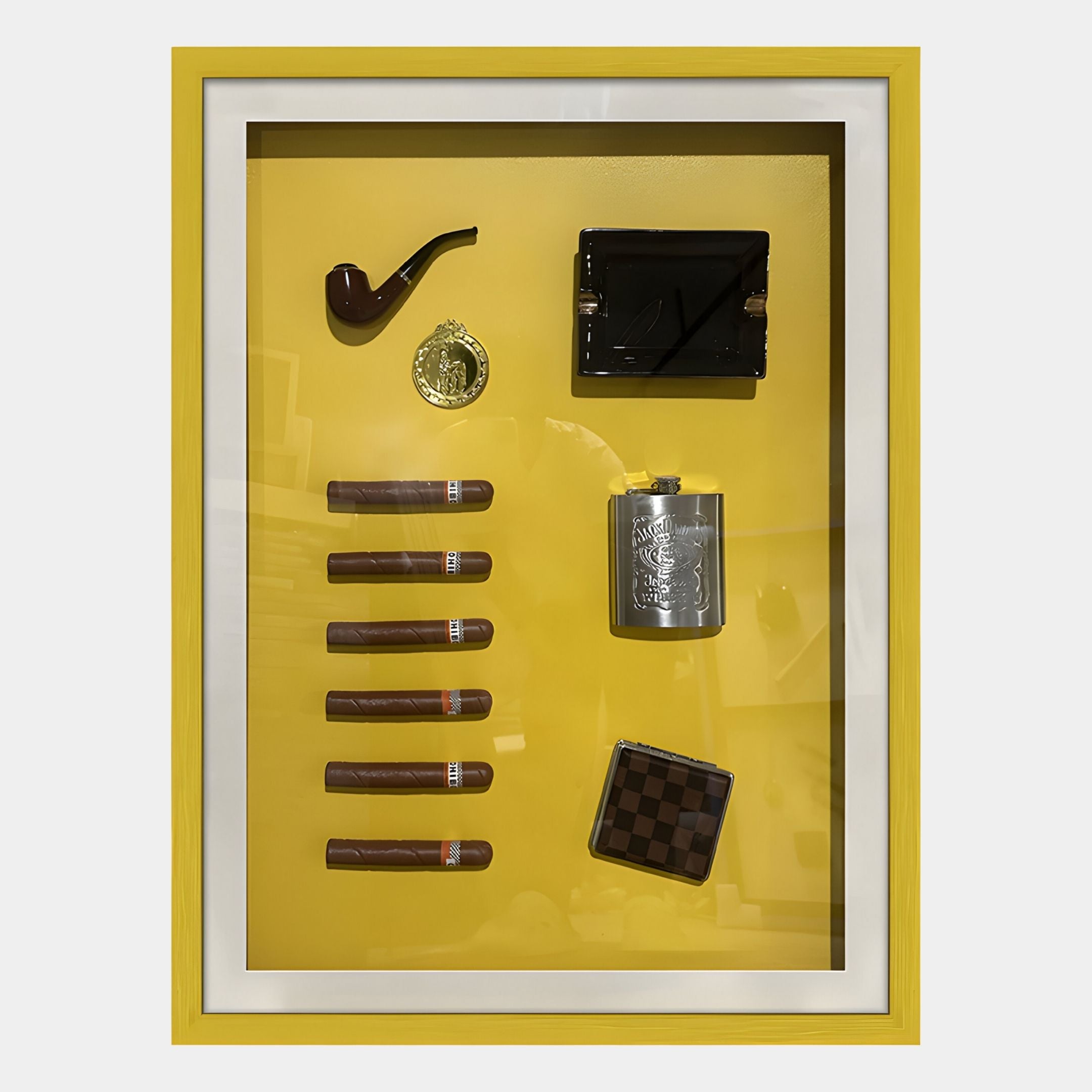 The Gentaro Cigar & Gentleman Collectible Display Wall Art by Giant Sculptures features a yellow frame with a smoker’s pipe, gold medallion, and six cigars—ideal for vintage decor or as unique cigar wall art.