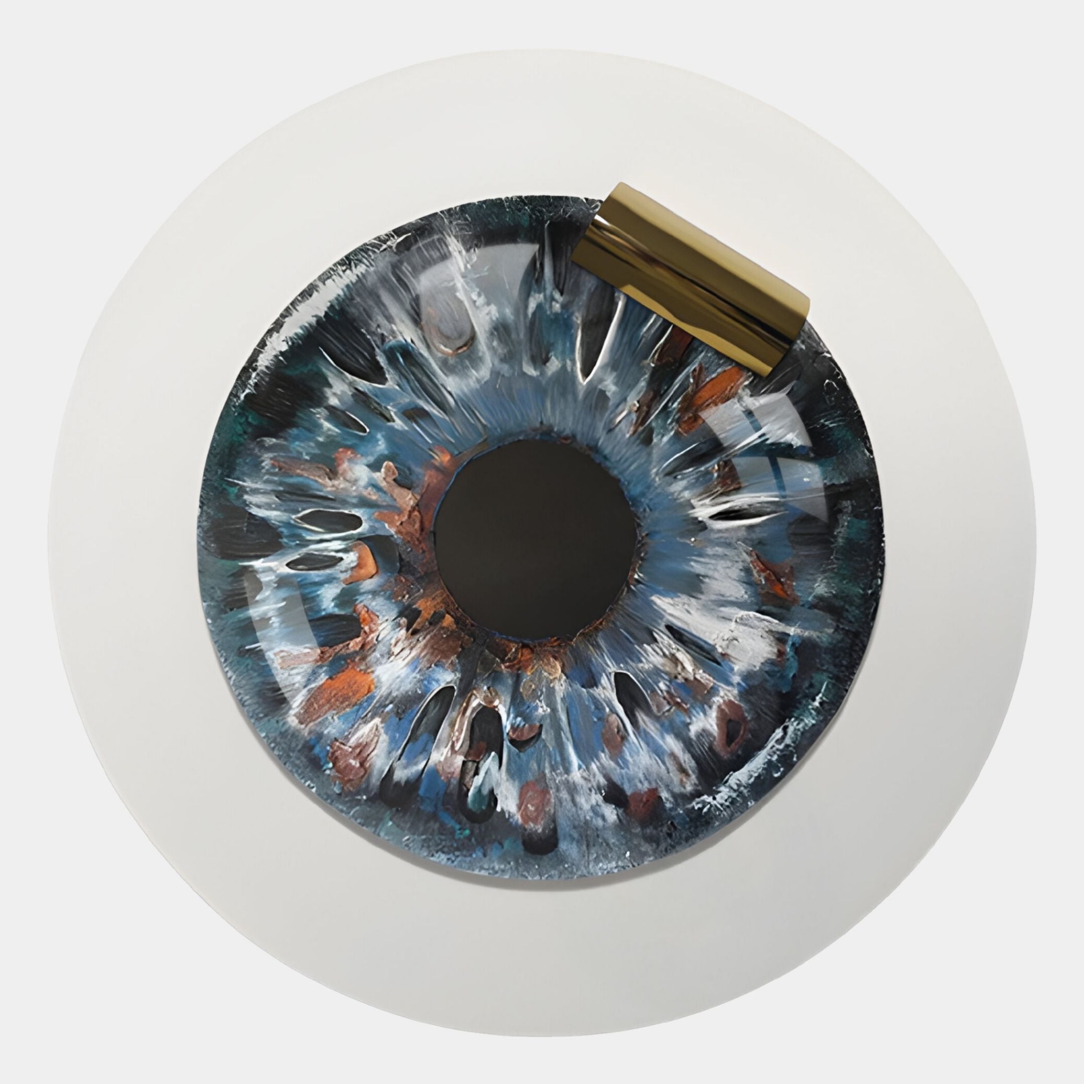 A round white table with a top design inspired by a blue, black, and copper iris and a brass accent—ideal for pairing with Giant Sculptures' Iriselle Molten Steel Crystal Porcelain Round 3D Wall Art.