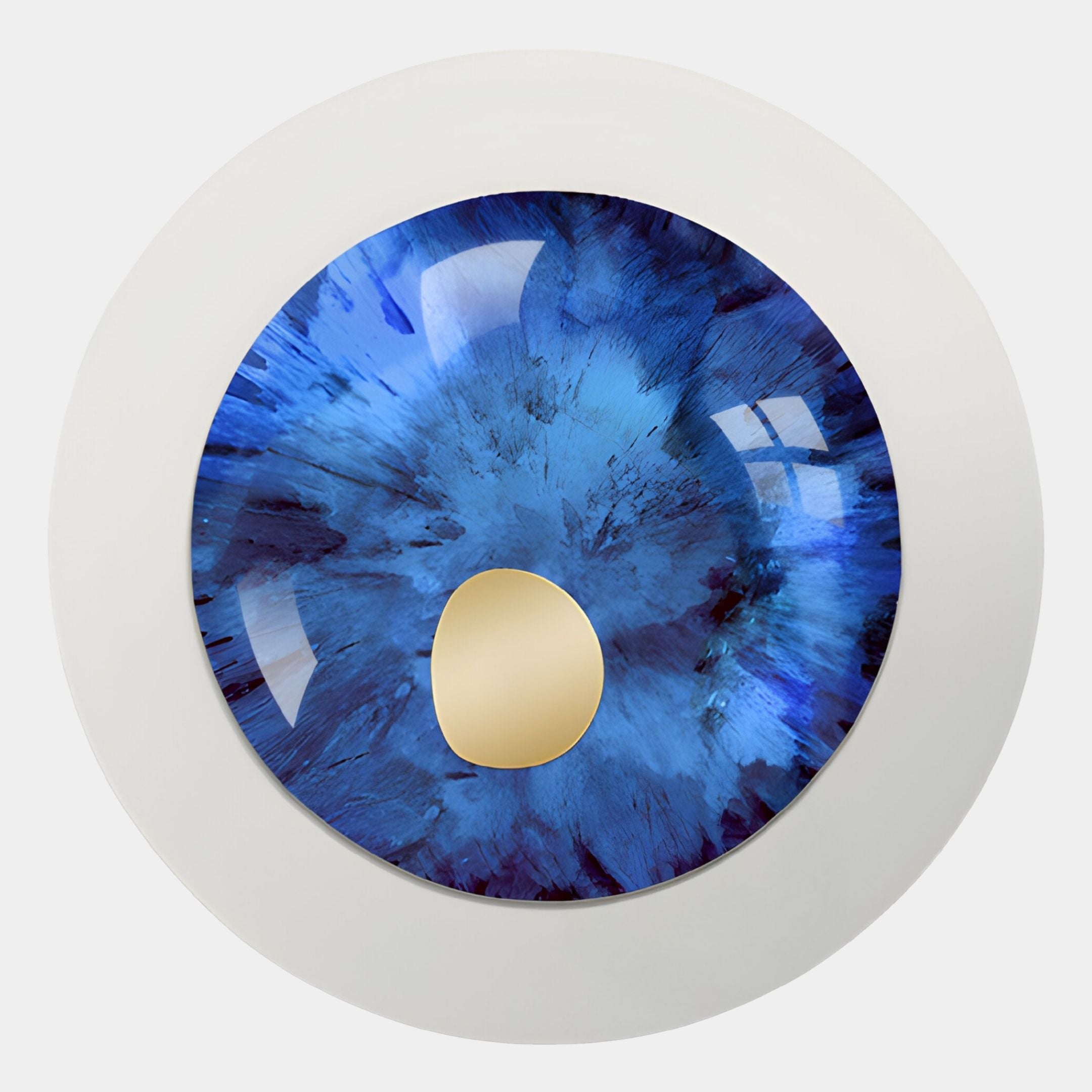 A close-up of the Iriselle Midnight Blue Crystal Porcelain Round 3D Wall Art by Giant Sculptures, featuring an iris-like design with a reflective gold oval center and white border—an eye-catching decorative piece.