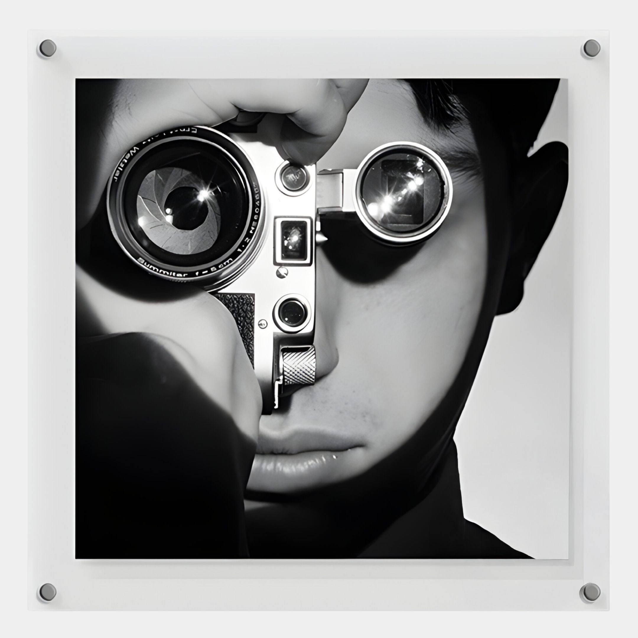 The CineLuxe Vintage Camera Boy Black & White Portrait Wall Art by Giant Sculptures features a striking image of a person holding a vintage camera, perfect for anyone seeking unique vintage-themed wall decor.