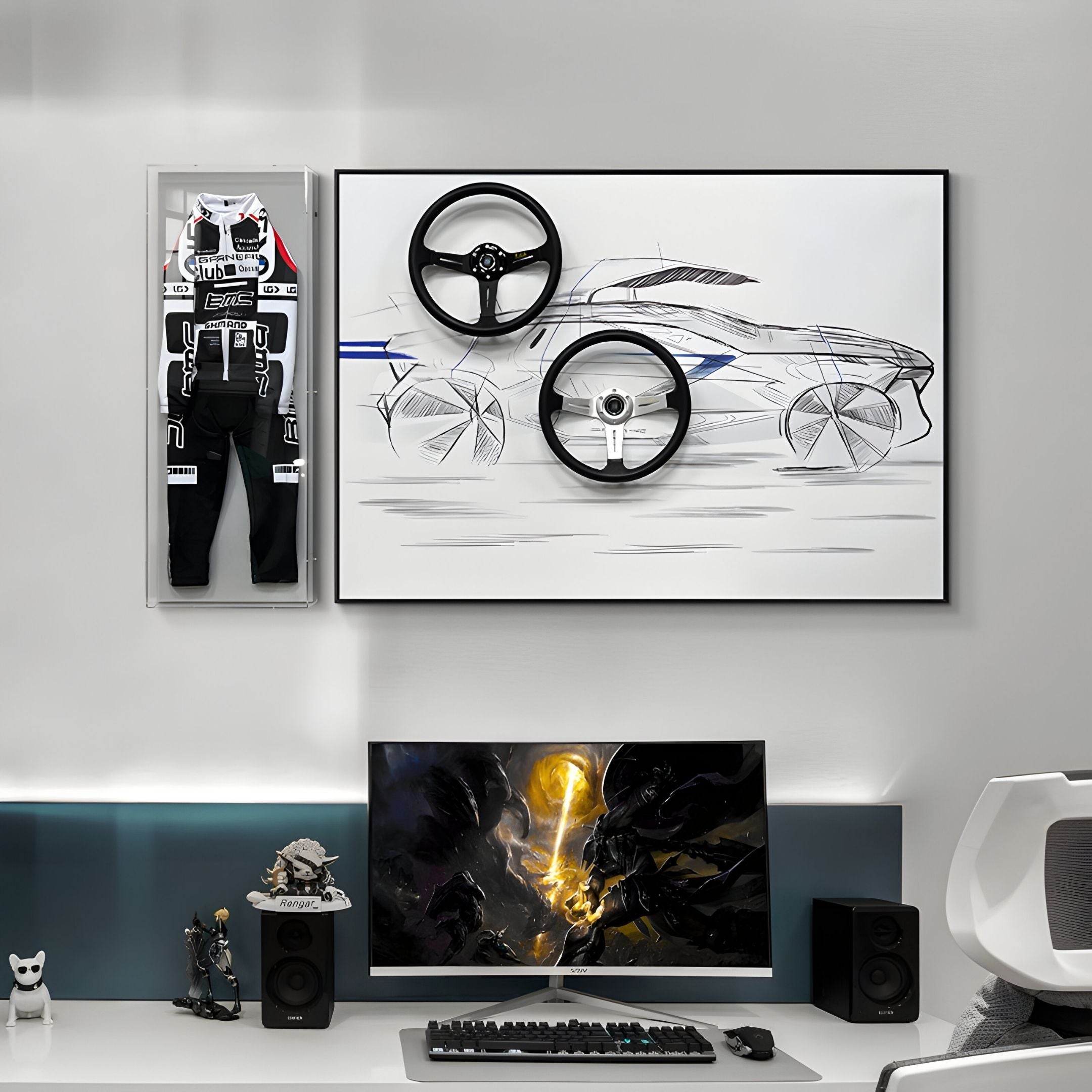 A modern desk setup features a monitor, keyboard, and speakers. Above the desk is the Apexline Motorsport Racing Suit Acrylic Box 3D Wall Art by Giant Sculptures, with car sketch art and real steering wheels and rims. Shelves display small figurines.