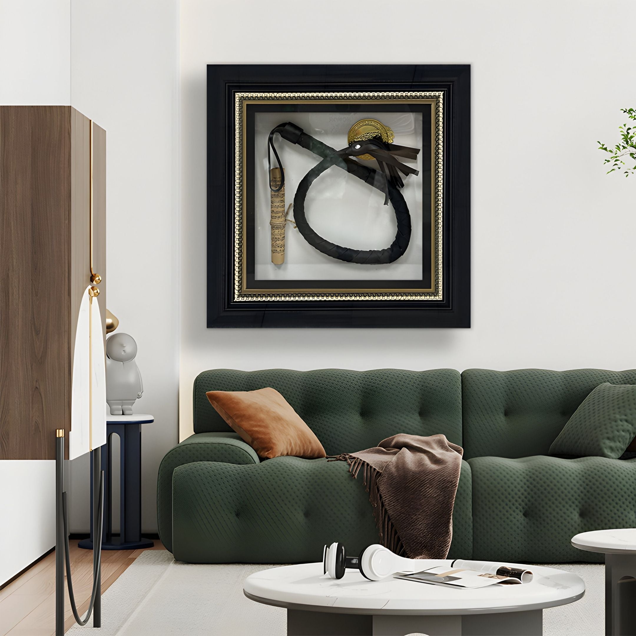 A modern living room featuring a green tufted sofa with brown and beige pillows, a brown throw, and a round coffee table. Above the sofa are Giant Sculptures' CurioVault Braided Leather Loop & Medallion Framed Wall Art.