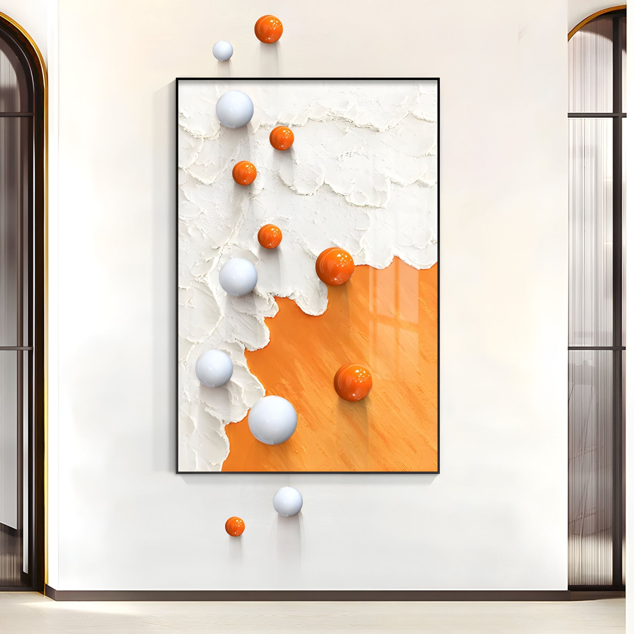 The Tideborne White & Orange Texture 3D Wall Art With Metal Balls by Giant Sculptures features textured paint and 3D spheres, making it perfect modern wall art for interiors, shown mounted on a white wall between two arched glass doorways.