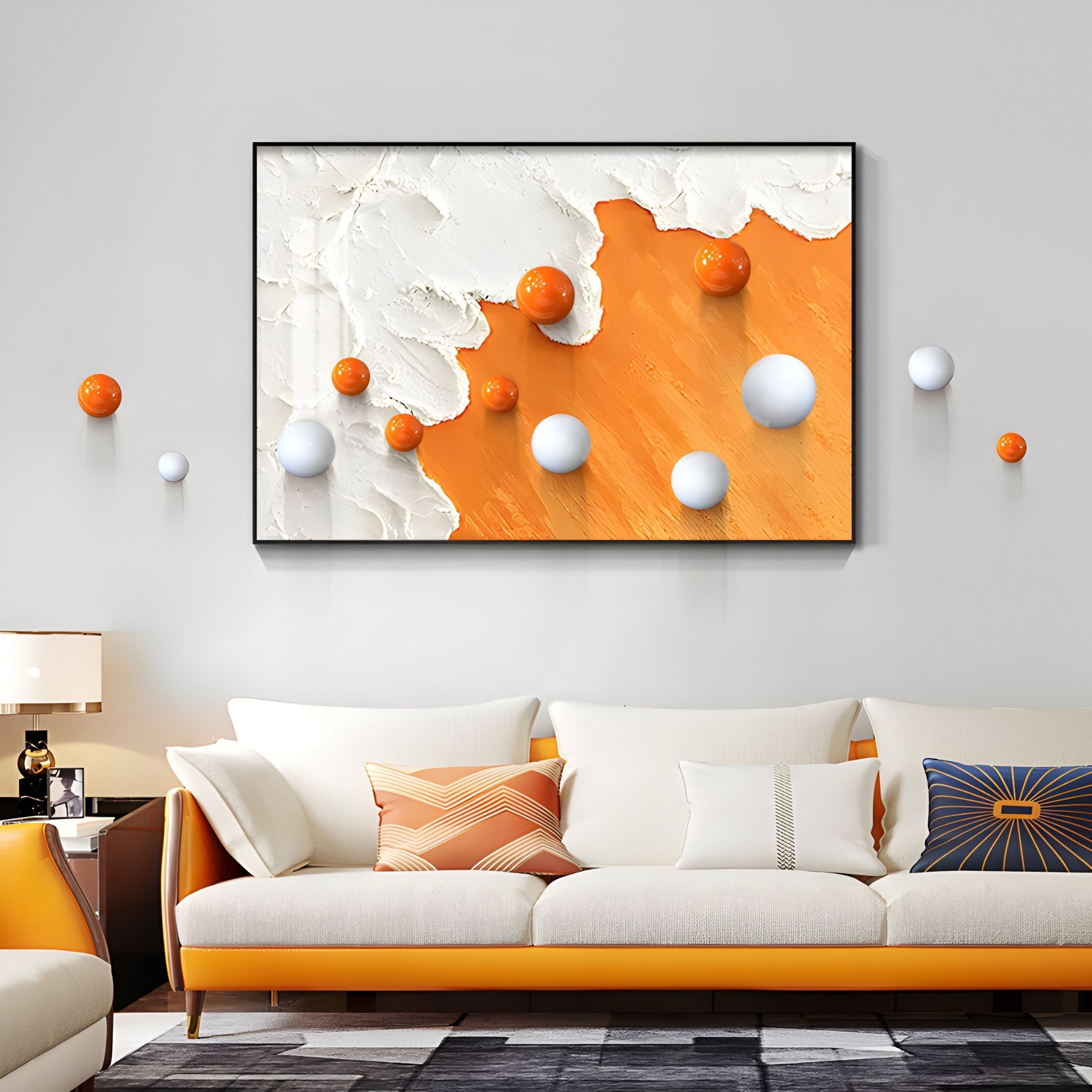 A modern living room features Giant Sculptures' Tideborne White & Orange Texture Horizontal 3D Wall Art With Metal Balls, paired with a matching white and orange sofa and geometric pillows for a cohesive, contemporary look.