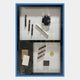 The Valet Noir Gentleman Cigar Gallery Box Framed Wall Art by Giant Sculptures features two sections with cigars, accessories, and luxury details—ideal for sophisticated decor. White background, blue border.