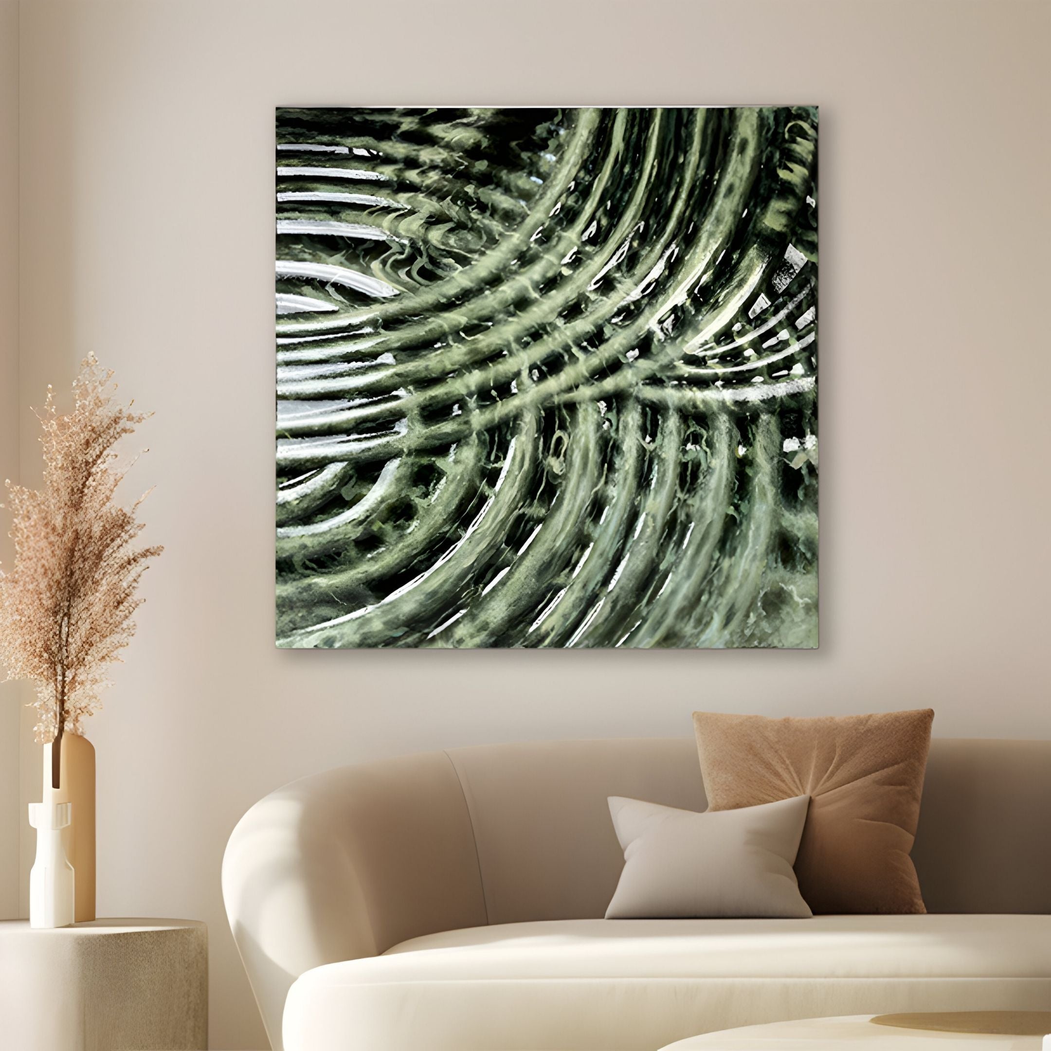 A modern living room features a white curved sofa with beige cushions. On the wall, the Rillora Sage Green Ribbed Wood Carving 3D Wall Art by Giant Sculptures adds interest. A beige vase with dried grasses sits on a side table.