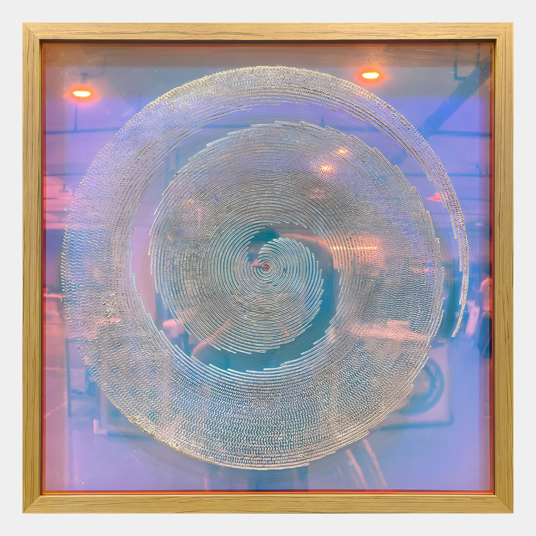The Halocrom Iridescent Spiral Texture Relief 3D Wall Art by Giant Sculptures features a metallic spiral design on a transparent surface, set against a blue and purple gradient with reflective room details in the background.
