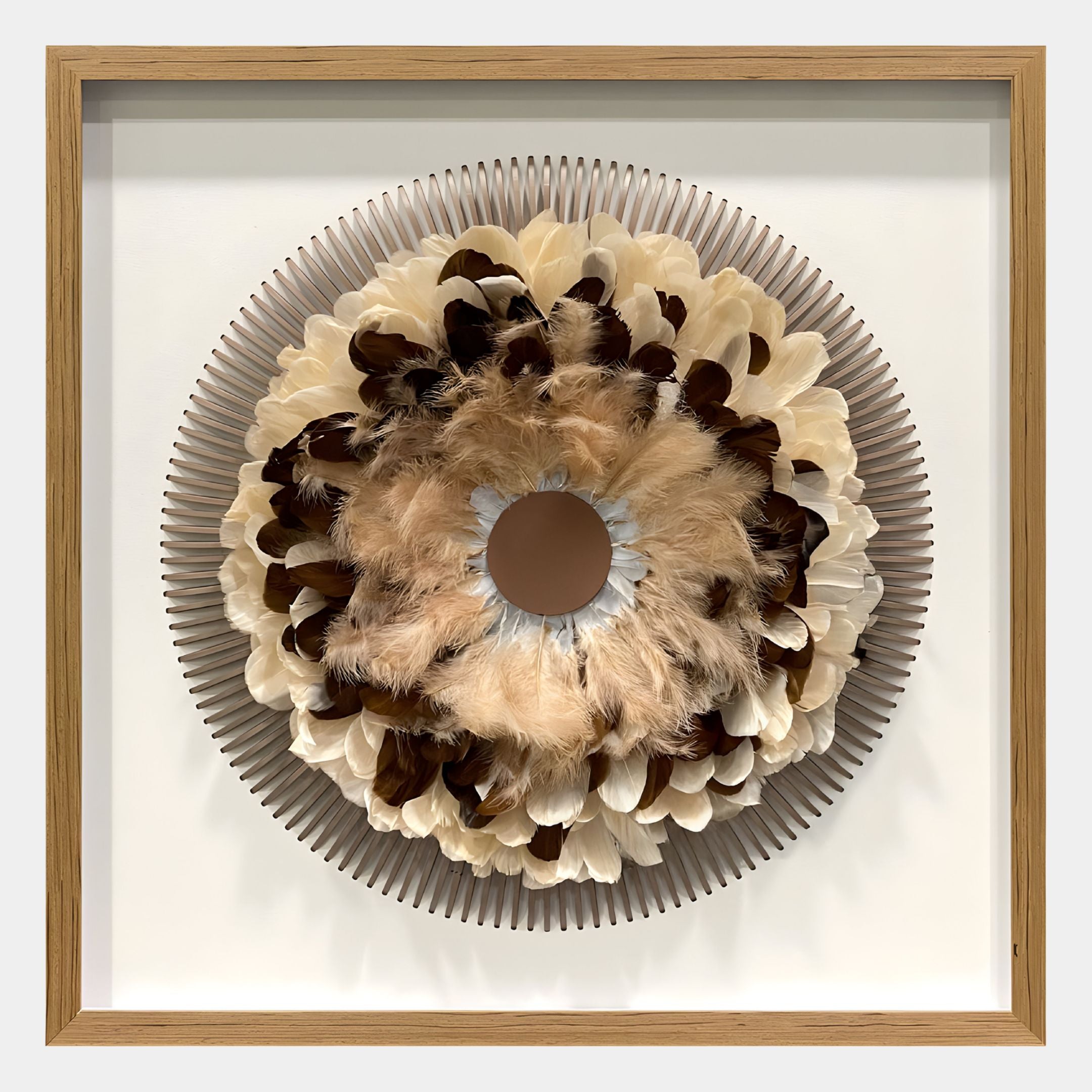 The Quillara Cream & Mocha Feather Halo 3D Wall Art by Giant Sculptures features a circular display of brown, cream, and black feathers on a textured backdrop in a light wooden frame—ideal for modern interiors.