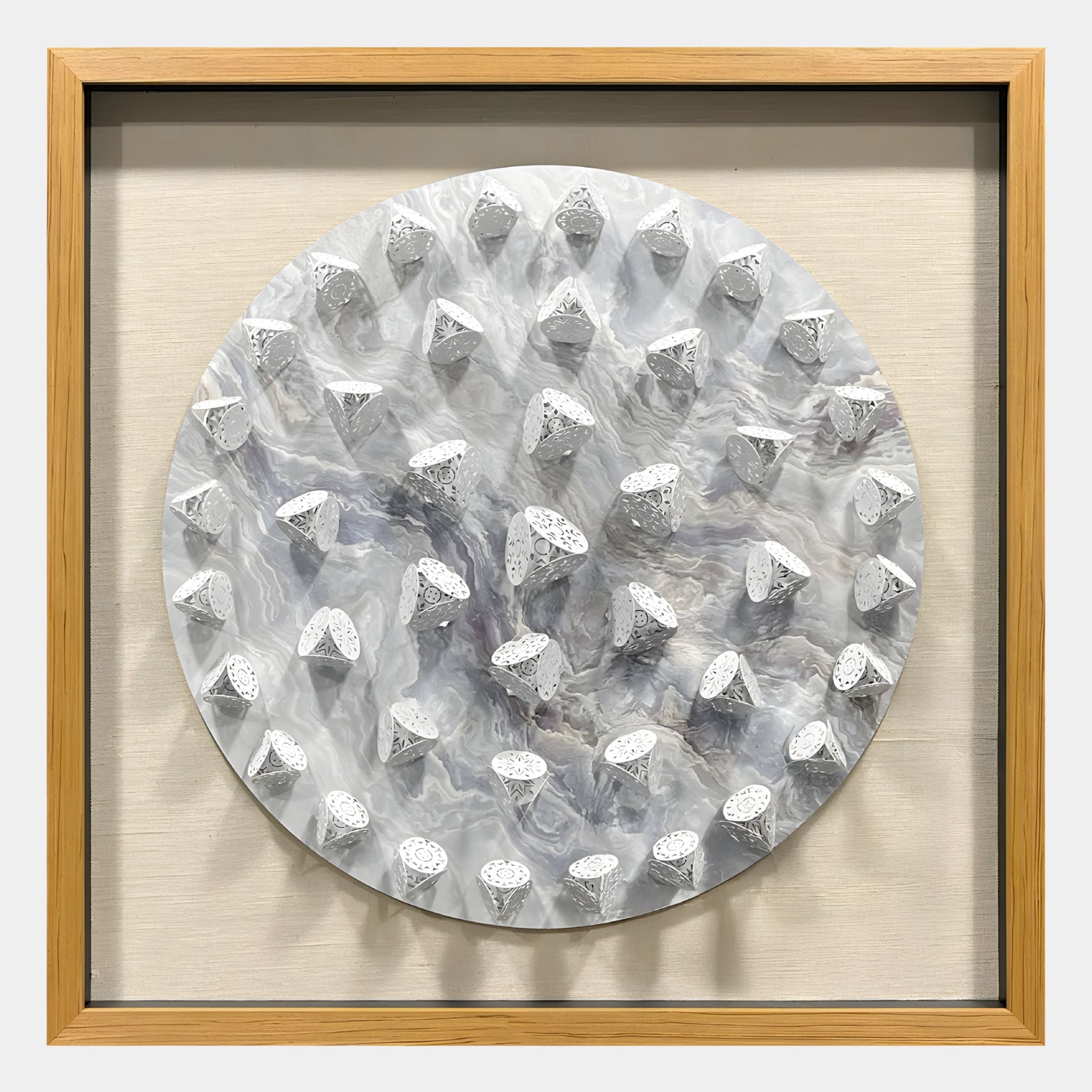 The Giant Sculptures Steelune Silver Metal Disc Spike 3D Wall Art features a circular marbled surface with evenly arranged white textured cone-shaped protrusions and a light wood frame for a striking modern wall accent.
