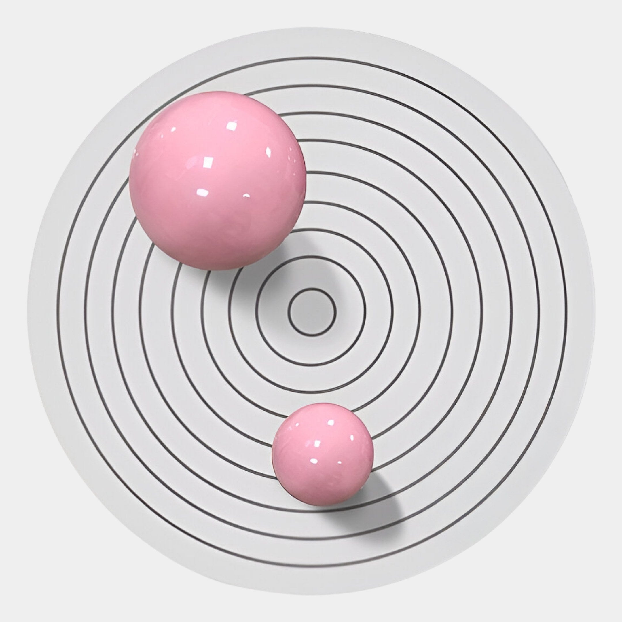 The Orbiora IV Pink Duo Concentric Sphere 3D Wall Art by Giant Sculptures features two glossy pink spheres on white with black rings, offering a geometric, minimalist aesthetic—ideal for contemporary wall decor.