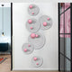 The Orbiora Pink Orb 5-Panel Concentric Sphere 3D Wall Art by Giant Sculptures features glossy pink orbs and black concentric rings, creating a bold modern focal point for any contemporary white wall.