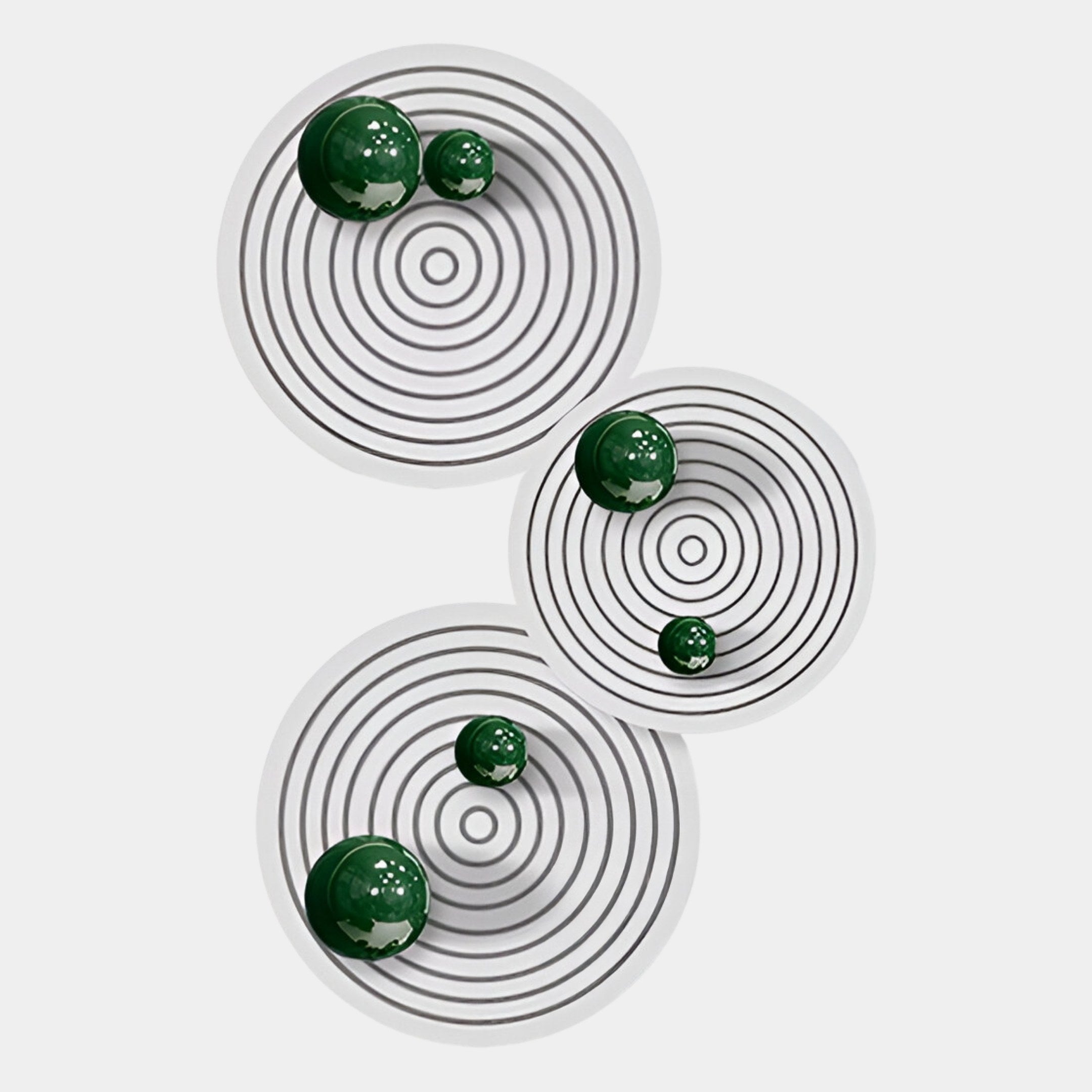 The Orbiora Green Orb 3-Panel Concentric Sphere 3D Wall Art by Giant Sculptures features white plates with black rings and glossy green spheres, arranged vertically for a bold, modern décor statement.