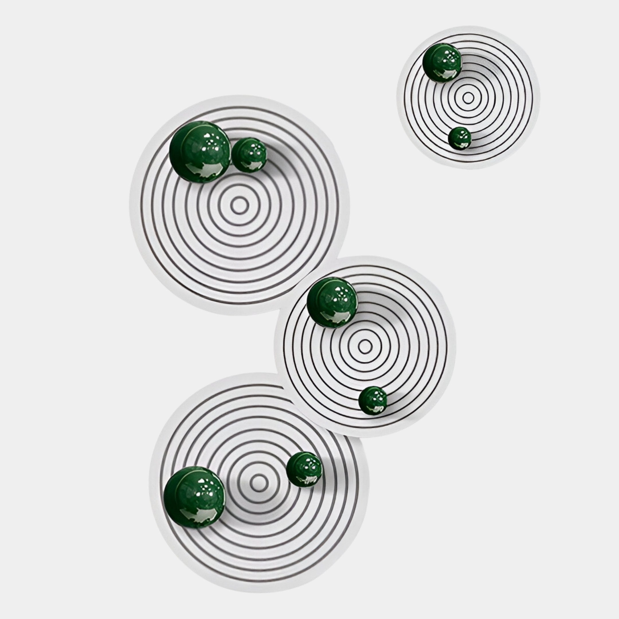 The Orbiora Green Orb 4-Panel Concentric Sphere 3D Wall Art by Giant Sculptures features shiny green marbles on white circular platforms with black rings, diagonally arranged for a striking wall display.