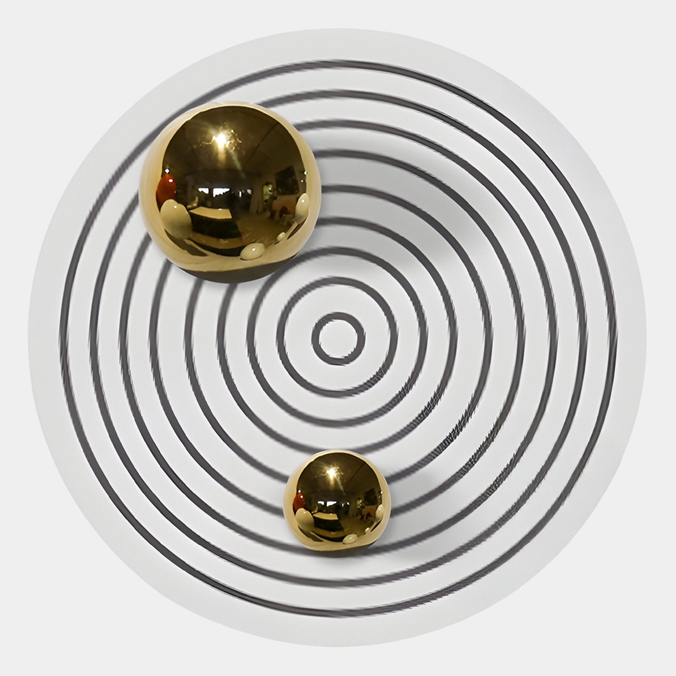 The Orbiora I Gold Duo Concentric Sphere 3D Wall Art by Giant Sculptures features two reflective gold spheres on black and white concentric rings, creating modern decor with striking reflections and shadows. Perfect for contemporary wall spaces.