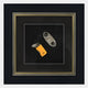The Havantra Cutter & Torch Cigar Accessory Framed Wall Art by Giant Sculptures showcases two distinct cigar cutters set against a black background with an ornate border, perfect for cigar enthusiasts’ décor.