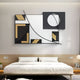 A modern bedroom features the Struktura Gold & Black Geometric Curve 3D Wall Art by Giant Sculptures, showcasing bold shapes and curved lines for a sophisticated, minimal, and contemporary interior decor.