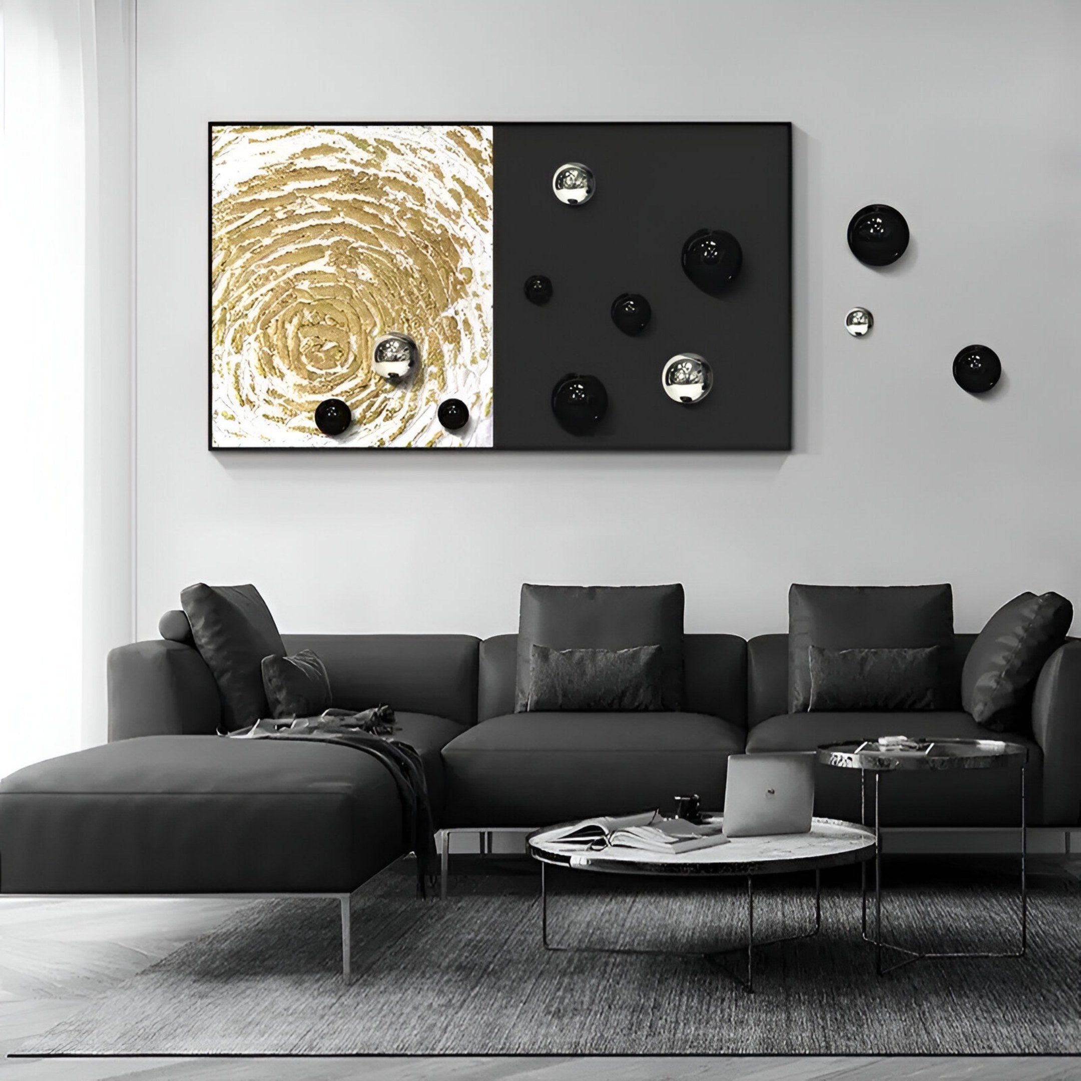 A modern living room featuring a dark gray sectional, round coffee table, and the Spherium Black & Silver Orb Dual-Tone Panel 3D Wall Art by Giant Sculptures with abstract gold spirals and sculptural spheres as a statement piece.
