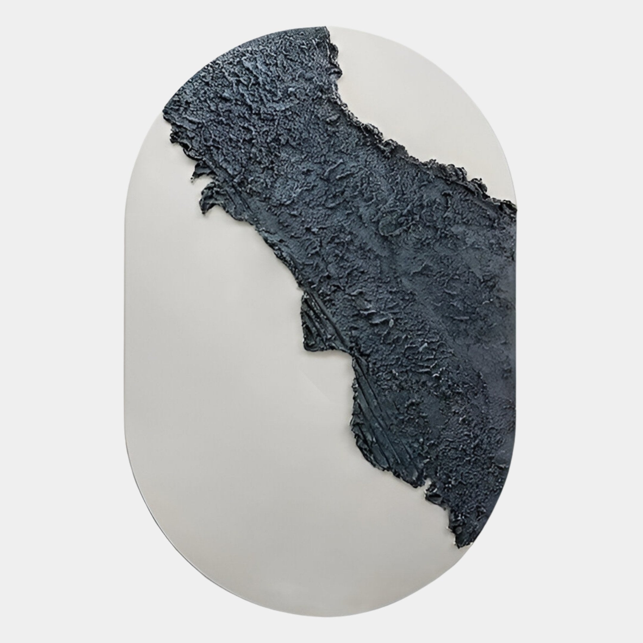 The Orrica Deep Charcoal Textured Relief 3D Wall Art by Giant Sculptures features striking wabi-sabi style with a raised, deep charcoal section crossing a smooth white oval background, evoking rough terrain or geographic forms.