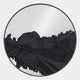 The Erosian Obsidian Drift Textured Round Mirror 3D Wall Art by Giant Sculptures features an abstract black pattern flowing across its lower half like brushstrokes on a white background.