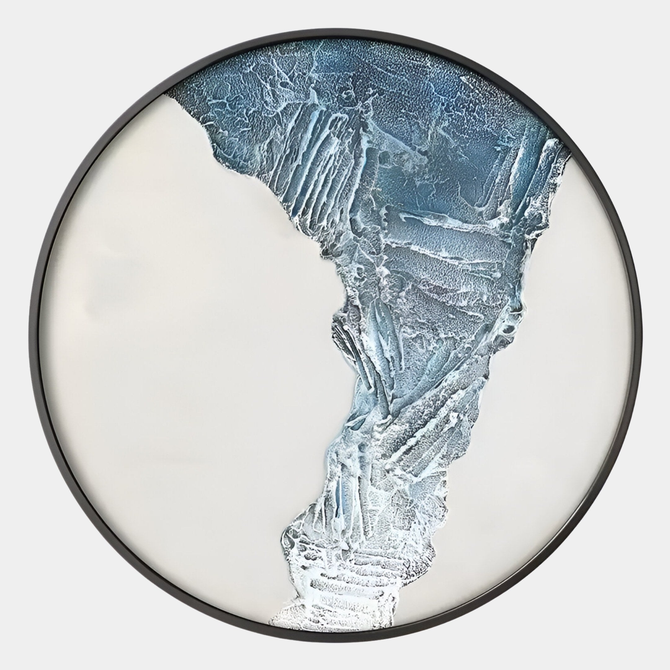 The Cryora Blue Flow Textured Round 3D Wall Art by Giant Sculptures features abstract blue and white patterns resembling an icy landscape, set in a thin black frame—perfect for adding modern style to your space.