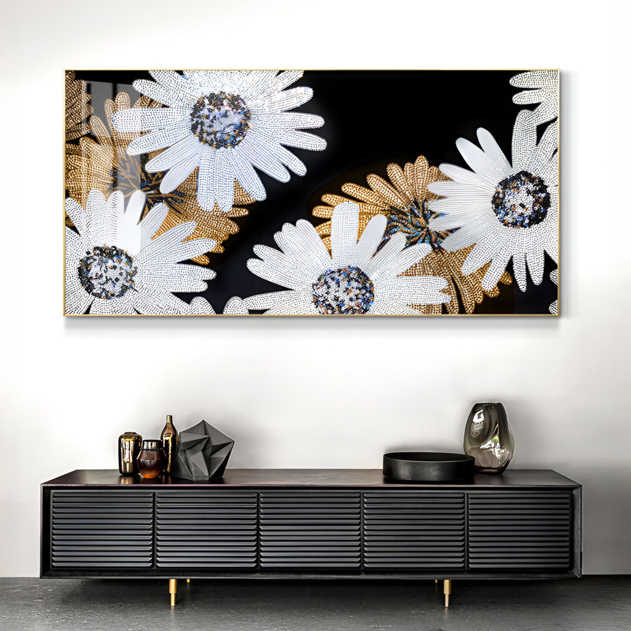 A modern living room featuring the Floravida White & Gold Crystal Daisy Floral 3D Wall Art by Giant Sculptures—striking white daisies with gold accents on black—paired with a black console table and decorative objects for bold contemporary decor.