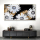 A modern living room featuring the Floravida White & Gold Crystal Daisy Floral 3D Wall Art by Giant Sculptures—striking white daisies with gold accents on black—paired with a black console table and decorative objects for bold contemporary decor.