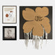 The Florayne 3-Set Ochre Woven Textured 3D Wall Art by Giant Sculptures includes a line-drawn face with geometric shapes, a black and white floral print, and a textured woven flower with hanging threads on a dark background.