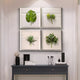 A modern entryway features a dark console table, decorative accents, and the Florvara Botanical Leaves 4-Panel Acrylic 3D Wall Art by Giant Sculptures arranged in a neat grid above—creating an inviting, Nordic-inspired space.