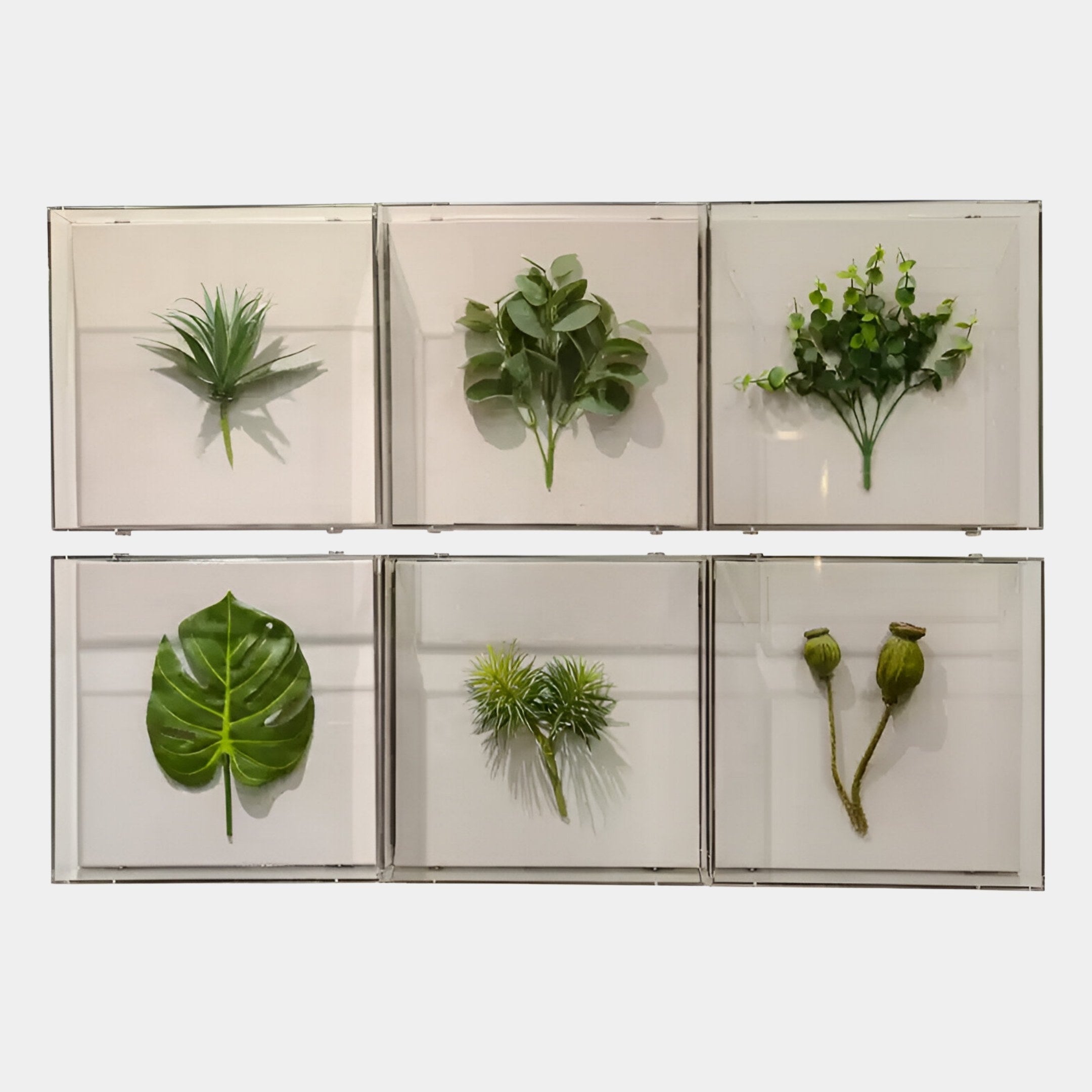 The Giant Sculptures Florvara Botanical Leaves 6-Panel Acrylic 3D Wall Art features six panels with assorted preserved or faux leaves, forming a striking display—an ideal modern accent for Nordic-styled interiors.
